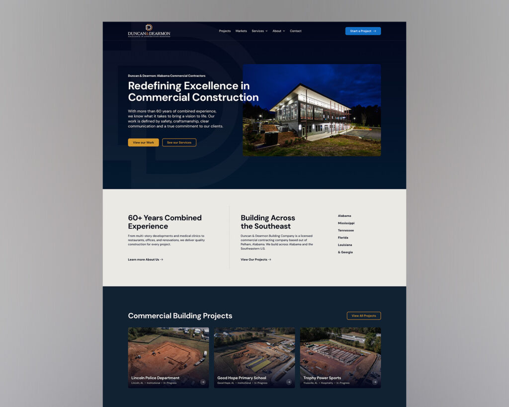 Duncan & Dearmon homepage with navy and gold branding, commercial construction photography, and featured building projects.